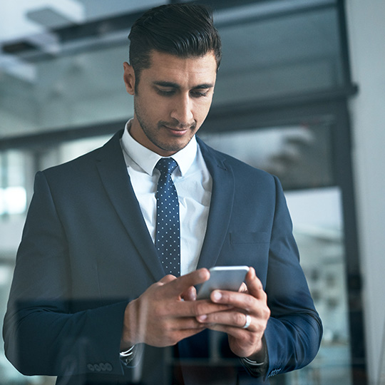 businessman checking his phone