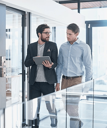 men looking into a tablet