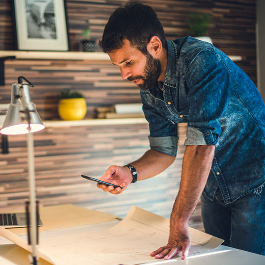 designer taking photos with mobile phone